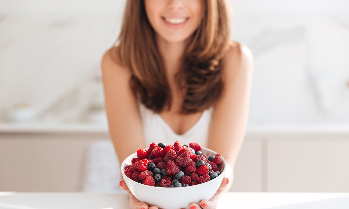 woman bowl berries